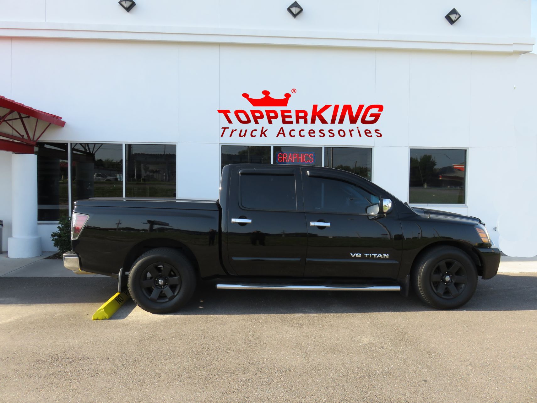 2005 Nissan Titan with LEER 700 tonneau, Nerf Bars, Bug Guard, Vent Visors, Tint, Hitch. Call TopperKING Brandon 813-689-2449 or Clearwater FL 727-530-9066.