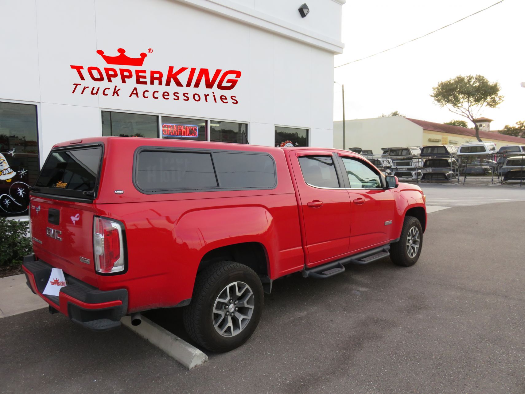 GMC Canyon with Ranch Sierra fiberglass topper, Side Steps, Hitch, Tint by TopperKING in Brandon, FL 813-689-2449 or Clearwater, FL 727-530-9066. Call now!