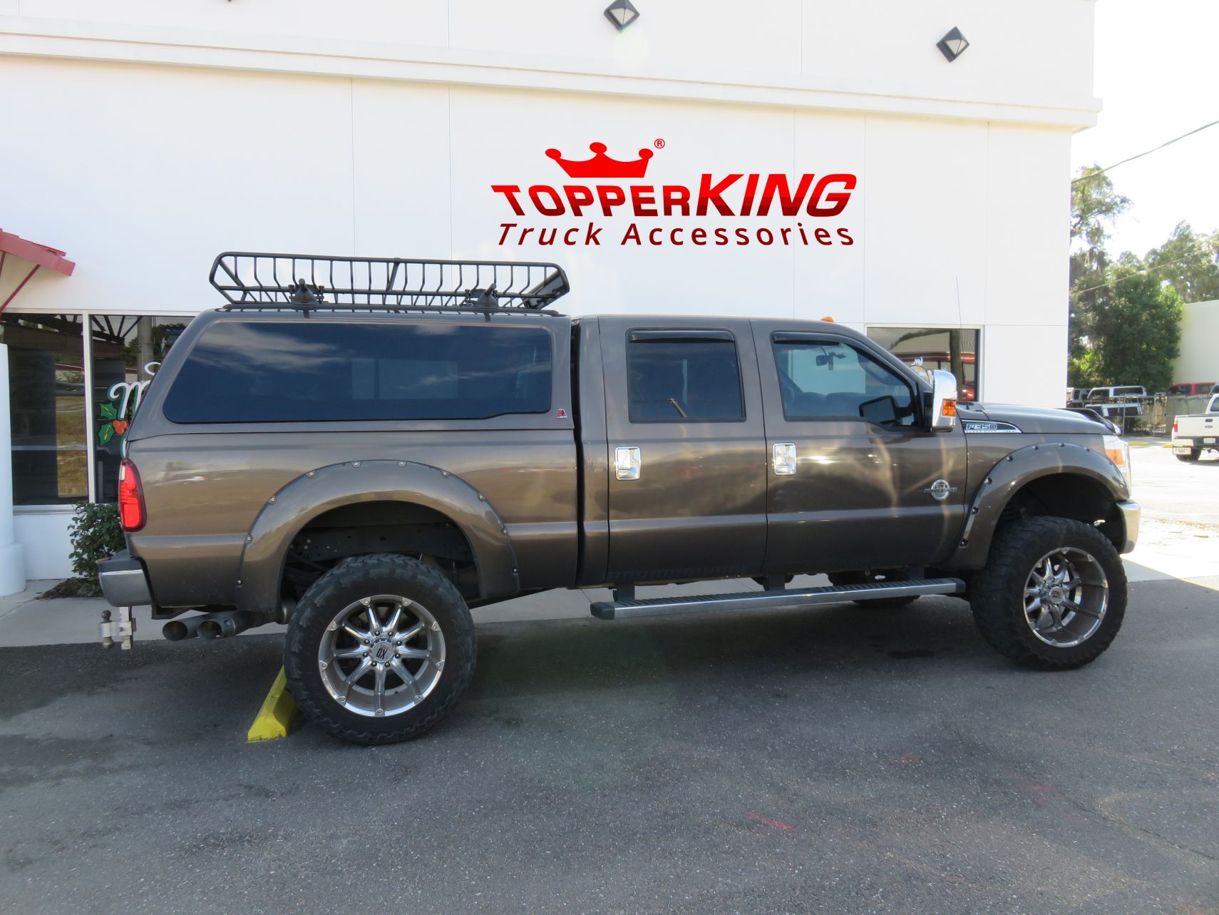 2016 Ford F250 with LEER 100XQ, Roof Rack, Fender Flares, Side Steps, Bug Guard, Vent Visor. Call TopperKING Brandon 813-689-2449 or Clearwater 727-530-9066