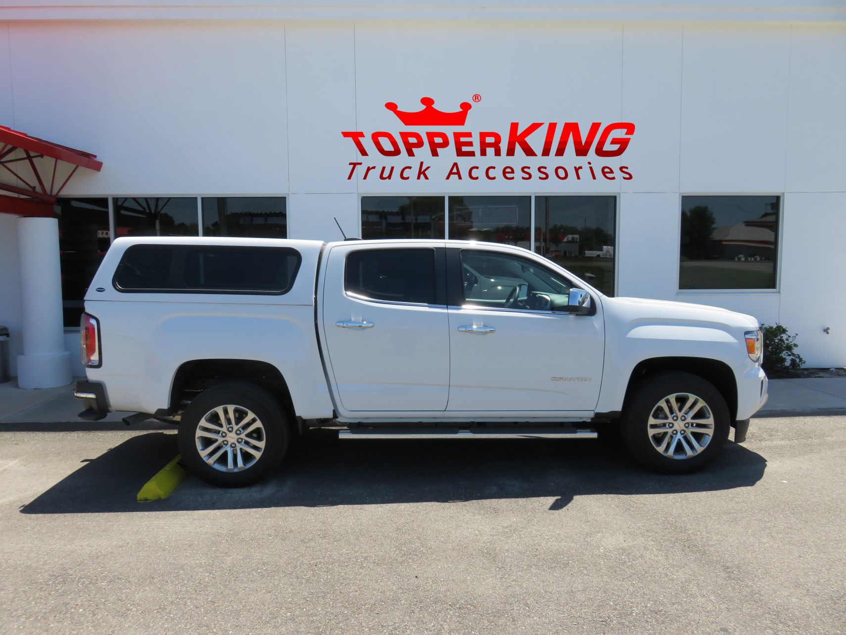 2016 GMC Canyon with Ranch Echo fiberglass topper, Running Boards, Tint, Hitch. Call TopperKING Brandon 813-689-2449 Clearwater 727-530-9066.