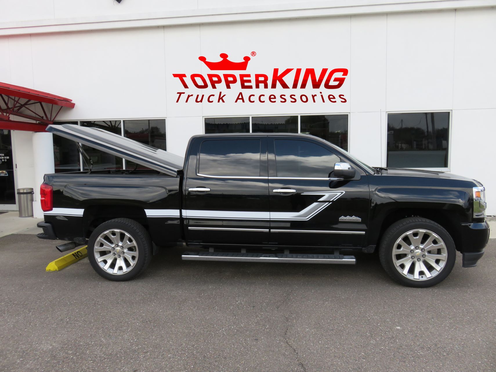 2017 Chevy Silverado with LEER 700, Side Steps, Bedliner, Graphics, Hitch. Call TopperKING Brandon 813-689-2449 or Clearwater 727-530-9066.