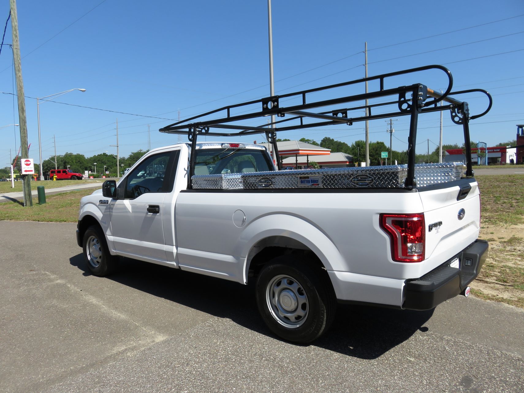 2017 Ford F150 with Commercial Ladder Rack, Aluminum Boxes, Hitch by TopperKING Brandon 813-689-2449 or Clearwater FL 727-530-9066. Call now!