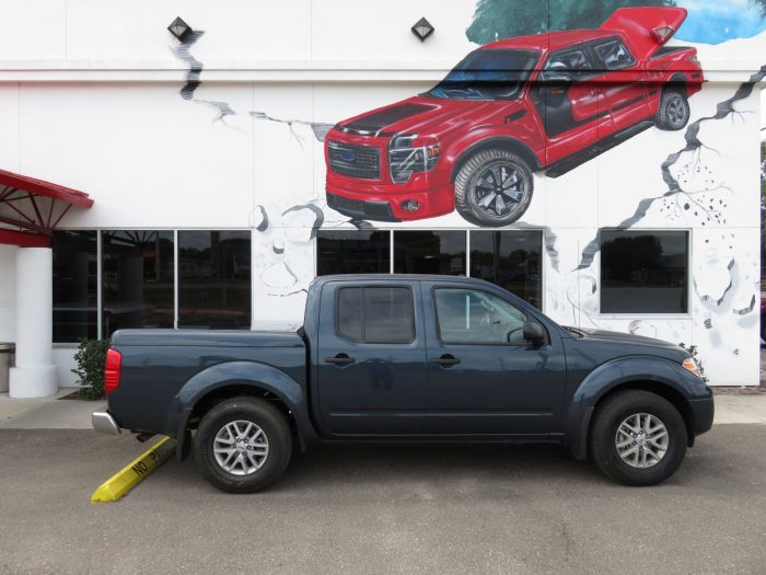 2015 Nissan Frontier with Ranch SportWrap Fiberglass Lid, Bedliner, Tint, Hitch by TopperKING Brandon 813-689-2449 or Clearwater FL 727-530-9066. Call Now!