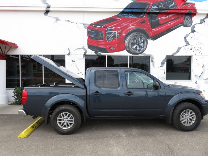 2015 Nissan Frontier with Ranch SportWrap Fiberglass Lid, Bedliner, Tint, Hitch by TopperKING Brandon 813-689-2449 or Clearwater FL 727-530-9066. Call Now!