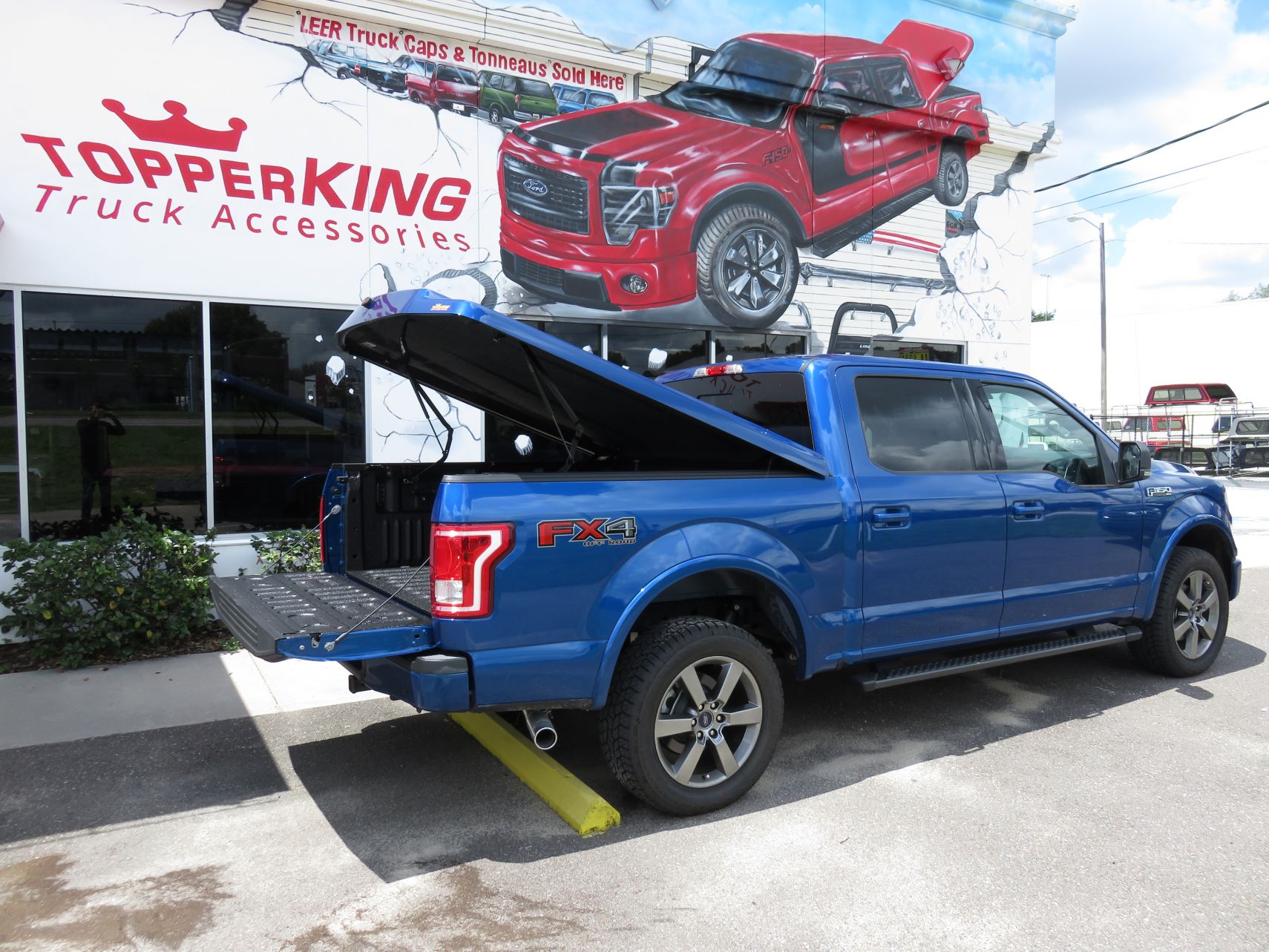 2017 Ford F150 with a LEER 700 Fiberglass Tonneau, Running Boards, Hitch, Tint by TopperKING Brandon 813-689-2449 or Clearwater FL 727-530-9066. Call now!