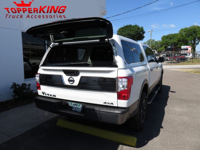 2017 Nissan Titan with LEER 100XL, Side Steps, Chrome Accessories, tint, Hitch by TopperKING Brandon 813-689-2449 or Clearwater FL 727-530-9066. Call today!