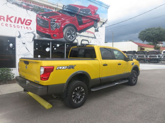 2017 Nissan Titan LEER 350M folding tonneau, Hitch, Running Boards, Tint. Call TopperKING in Brandon 813-689-2449 Clearwater 727-530-9066.