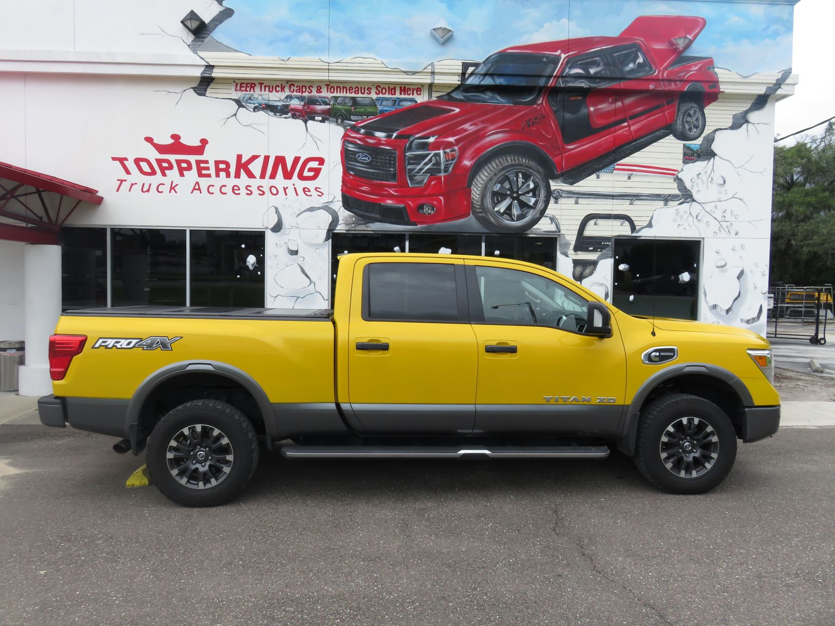 2017 Nissan Titan LEER 350M folding tonneau, Hitch, Running Boards, Tint. Call TopperKING in Brandon 813-689-2449 Clearwater 727-530-9066.