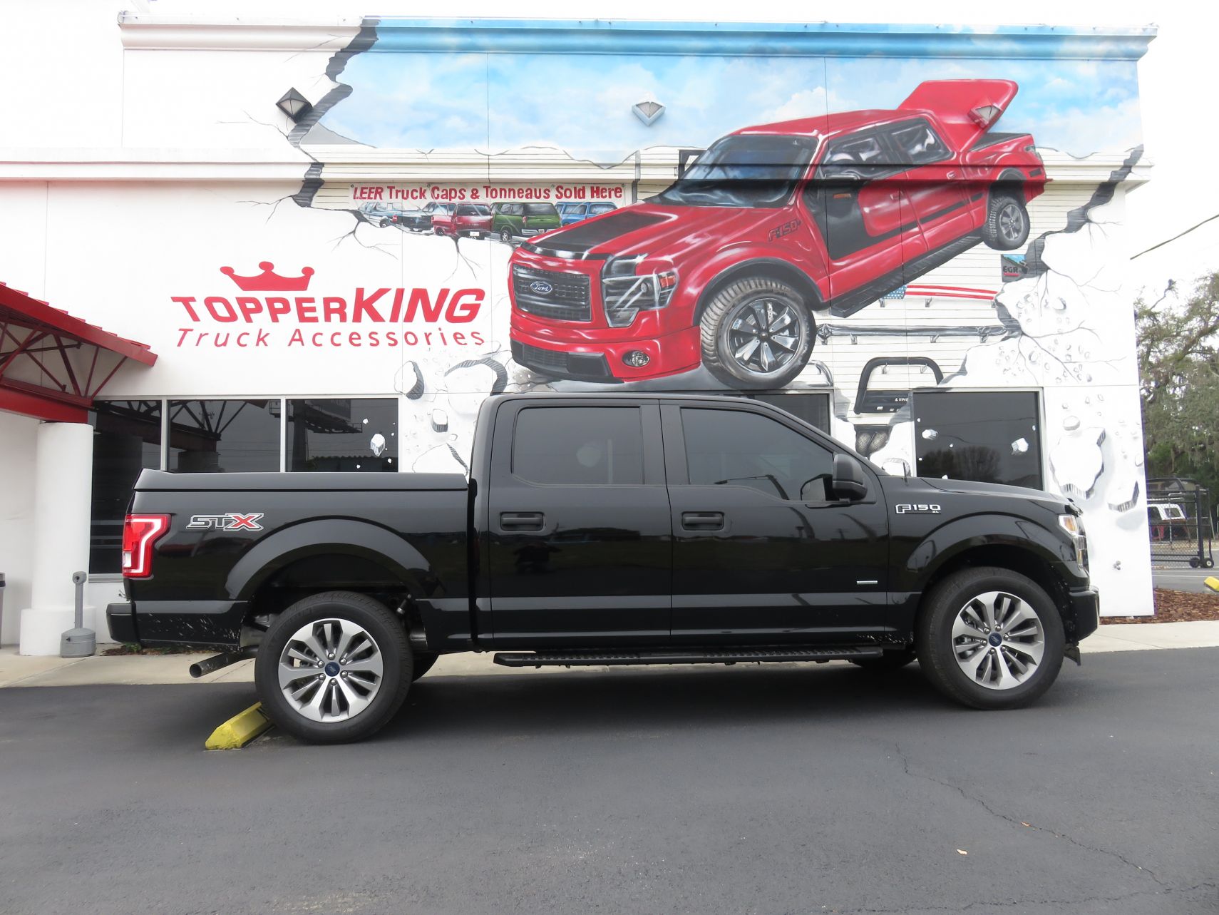 2015 Ford F150 with LEER 750 Sport tonneau, Running Boards, Hitch, Tint by TopperKING Brandon, FL 813-689-2449 or Clearwater, FL 727-530-9066. Call today!