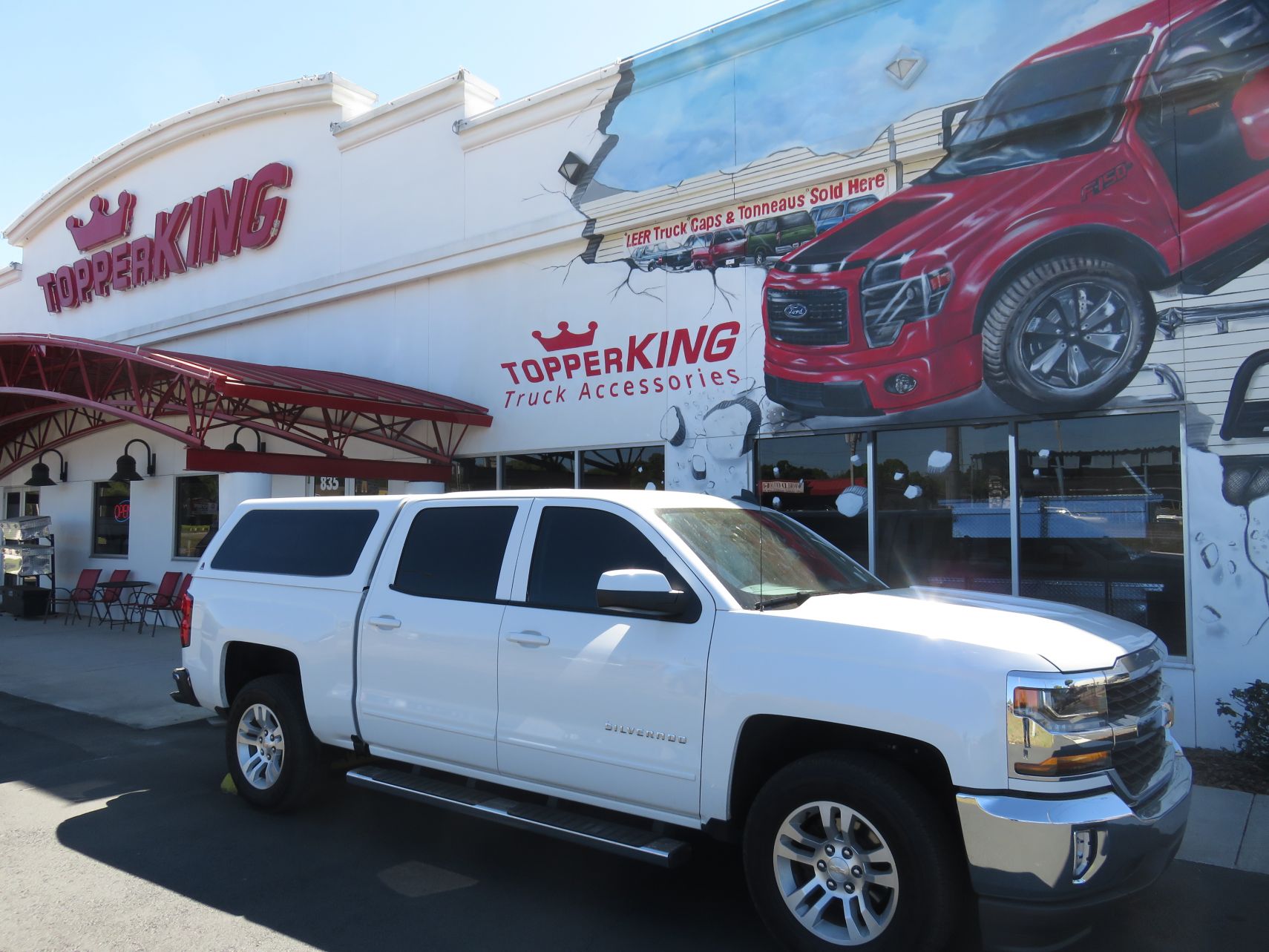 2017 Chevrolet Silverado with LEER 100XQ, Nerf Bars, Hitch, Tint by TopperKING Brandon 813-689-2449 or Clearwater FL 727-530-9066. Call today!