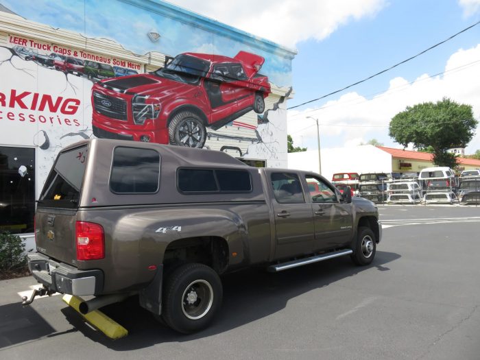 2013 Chevy Silverado with LEER 122, Nerf Bars, Hitch, Tint by TopperKING in Brandon, FL 813-689-2449 or Clearwater, FL 727-530-9066. Call today to start!