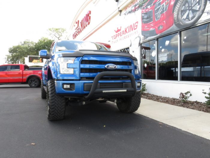 2015 Ford F150 with LEER 350M, Bull Bar, Side Steps, Graphics, Fender Flares. Call TopperKING Brandon 813-689-2449 or Clearwater 727-530-9066!