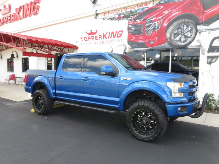 2015 Ford F150 with LEER 350M, Bull Bar, Side Steps, Graphics, Fender Flares. Call TopperKING Brandon 813-689-2449 or Clearwater 727-530-9066!