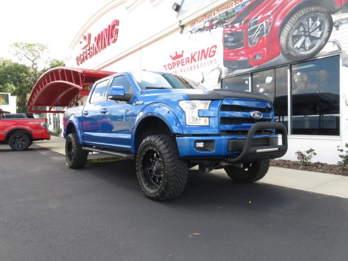 2015 Ford F150 with LEER 350M, Bull Bar, Side Steps, Graphics, Fender Flares. Call TopperKING Brandon 813-689-2449 or Clearwater 727-530-9066!