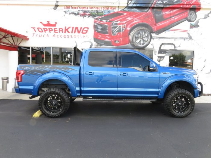 2015 Ford F150 with LEER 350M, Bull Bar, Side Steps, Graphics, Fender Flares. Call TopperKING Brandon 813-689-2449 or Clearwater 727-530-9066!