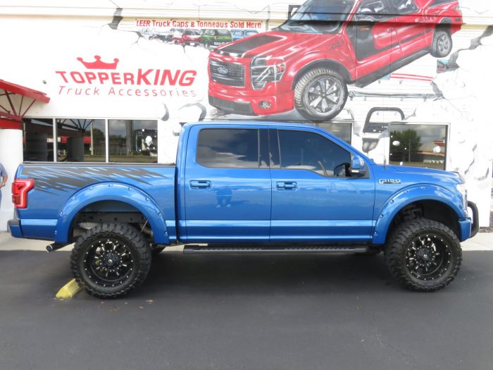 2015 Ford F150 with LEER 350M, Bull Bar, Side Steps, Graphics, Fender Flares. Call TopperKING Brandon 813-689-2449 or Clearwater 727-530-9066!
