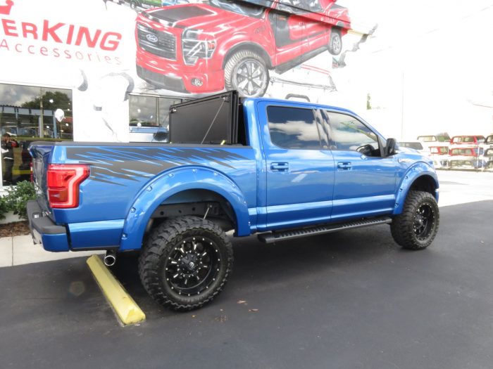 2015 Ford F150 with LEER 350M, Bull Bar, Side Steps, Graphics, Fender Flares. Call TopperKING Brandon 813-689-2449 or Clearwater 727-530-9066!