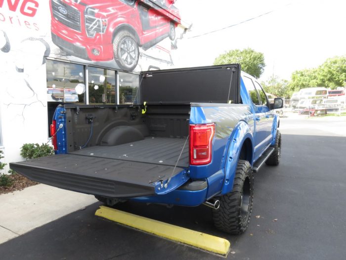 2015 Ford F150 with LEER 350M, Bull Bar, Side Steps, Graphics, Fender Flares. Call TopperKING Brandon 813-689-2449 or Clearwater 727-530-9066!