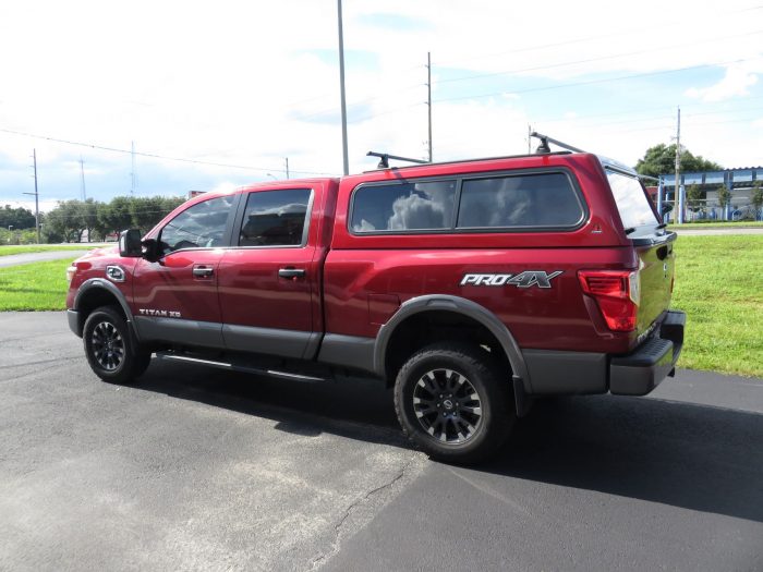 2018 Nissan Titan with Leer 100R, Roof Racks, Hitch, Nerf Bars, Tint by TopperKING in Brandon, FL 813-689-2449 or Clearwater, FL 727-530-9066. Call Today!