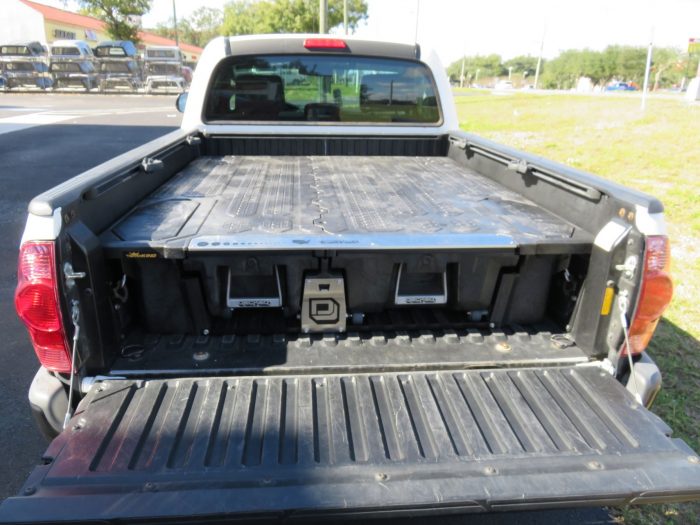 2010 Toyota Tacoma with Decked Cargo Management, Bedliner, Tint, Hitch by TopperKING in Brandon, FL 813-689-2449 or Clearwater, FL 727-530-9066. Call today!