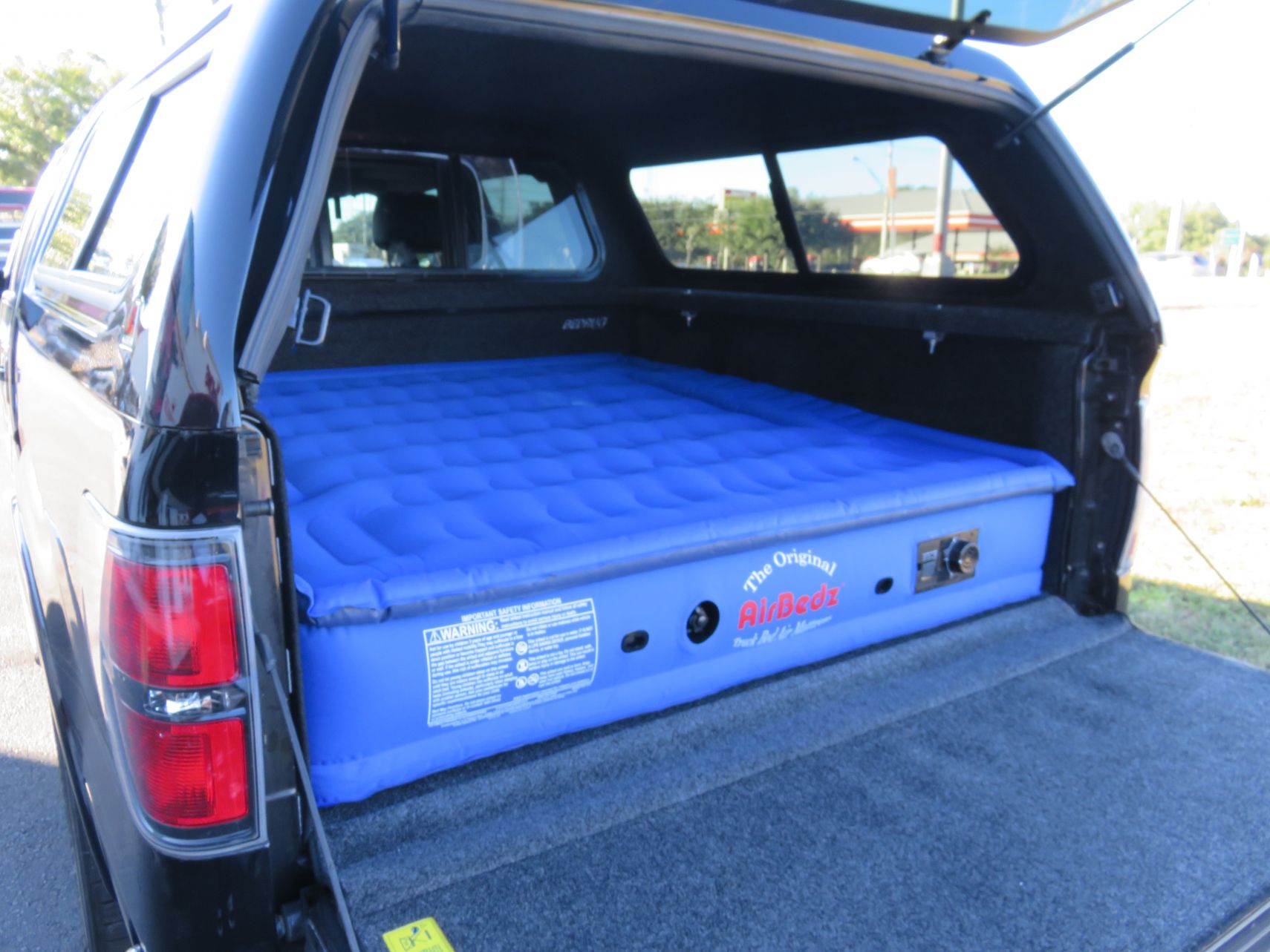 2013 Ford F150 with LEER 100XR, Nerf Bars, BedRug, AirBedz, Tint, Hitch by TopperKING in Brandon, FL 813-689-2449 or Clearwater, FL 727-530-9066. Call Now!