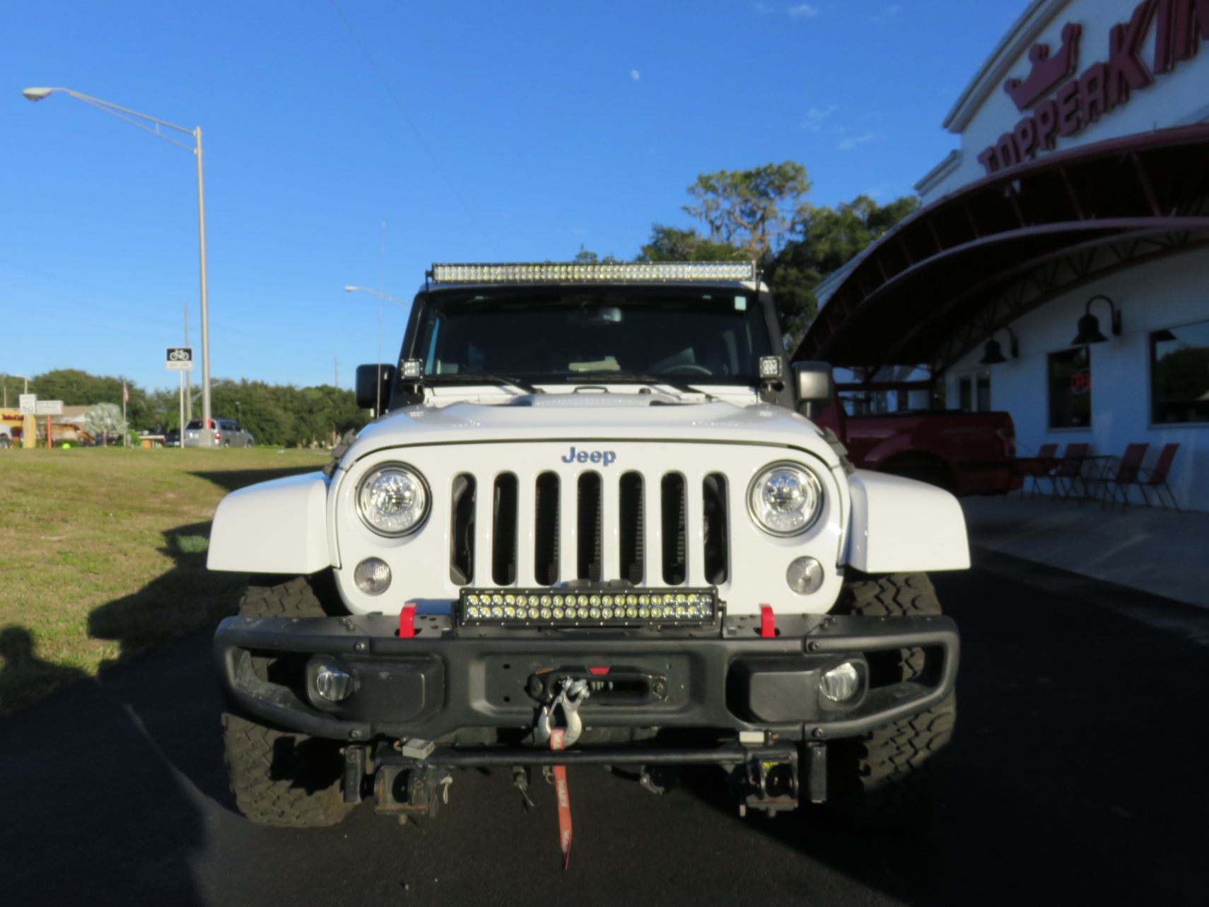 2017 Jeep Wrangler with Bumper and Light Bars, Tint, Hitch by TopperKING Brandon 813-689-2449 or Clearwater FL 727-530-9066. Call Us Today!