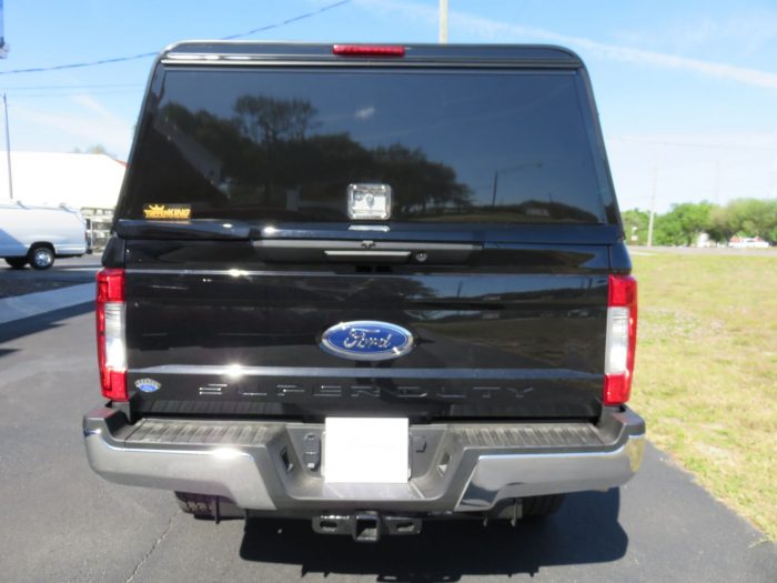 2019 Black Ford F250 LEER DCC Construction Topper, Nerf Bars, Hitch by TopperKING in Brandon, FL 813-689-2449 or Clearwater, FL 727-530-9066. Call today!