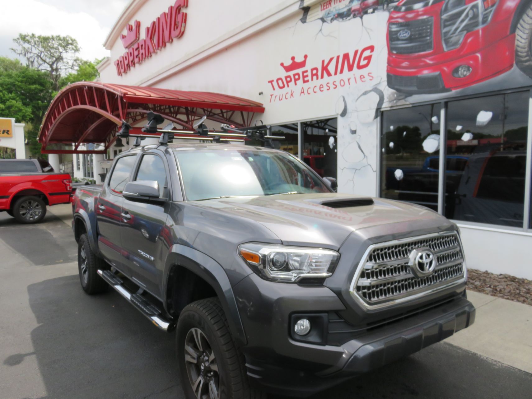 2019 Toyota Tacoma with LEER 350M, Yakima Rack, Nerf Bars, Hitch, Tint. Call TopperKING Brandon 813-689-2449 or Clearwater FL 727-530-9066.