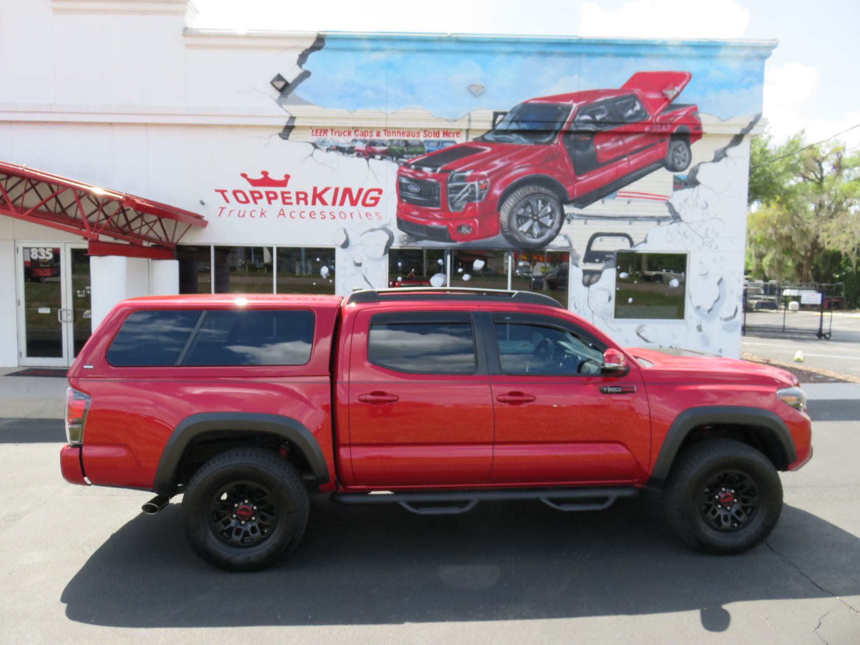 2019 Toyota Tacoma with Ranch Icon, Nerf Bars, Roof Rack, Hitch, Fender Flares by TopperKING Brandon 813-689-2449 Clearwater FL 727-530-9066.