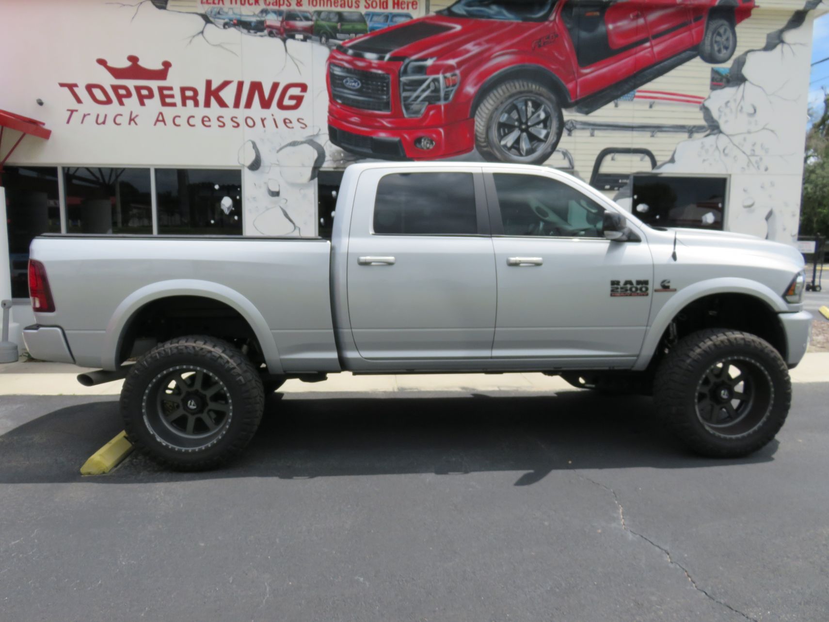 2019 Dodge RAM with LEER 350M Folding Tonneau, Custom Grill, Tint, Hitch by TopperKING in Brandon, FL 813-689-2449 or Clearwater, FL 727-530-9066. Call Now!