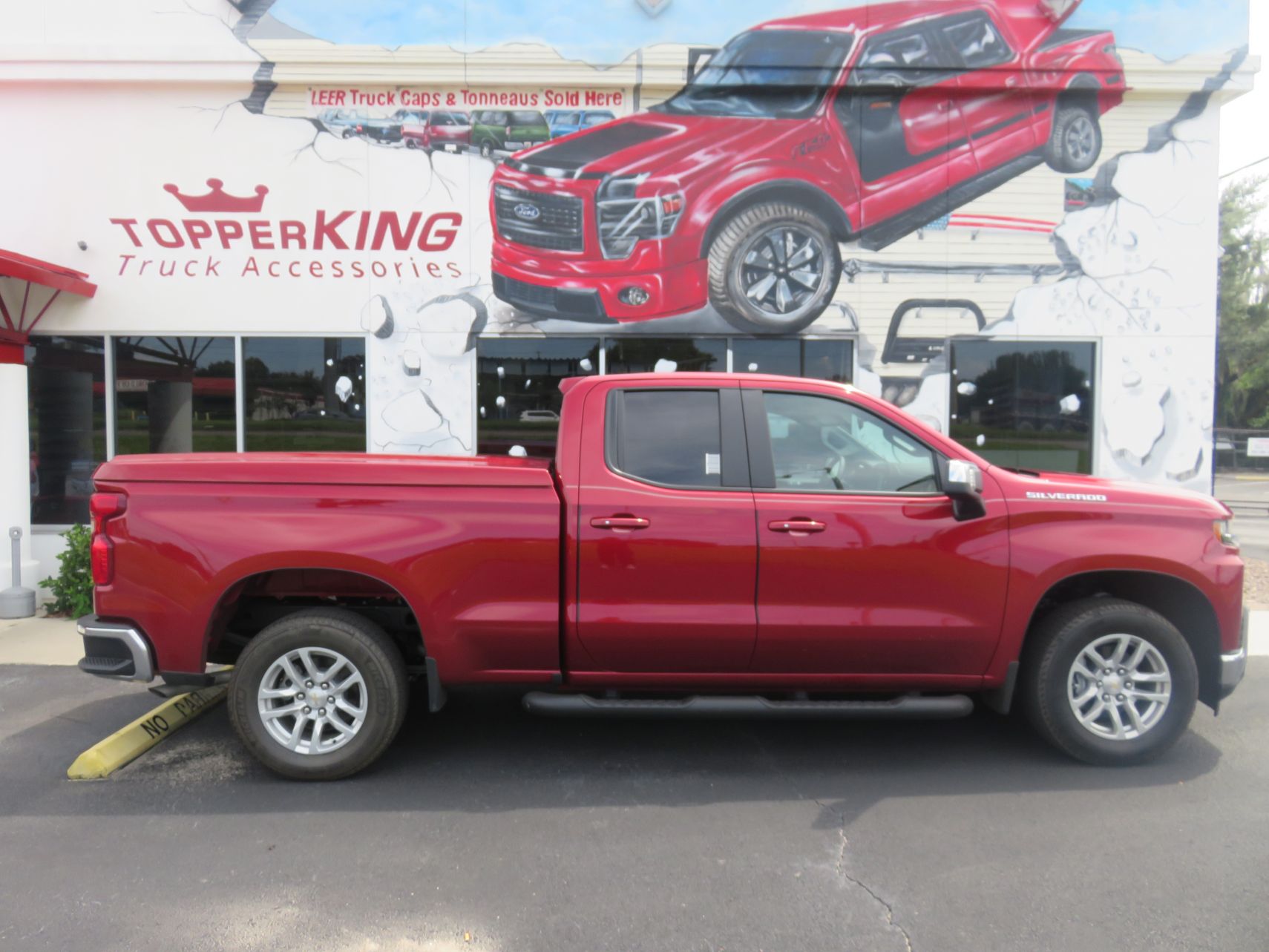 2019 Chevy Silverado with LEER 700 Tonneau, Blackout Nerf Bars, Hitch, Tint. Call TopperKING in Brandon, FL 813-689-2449 or Clearwater, FL 727-530-9066!