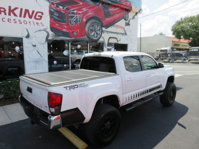 2019 Toyota Tacoma with LEER 350M, Nerf Bars, Hitch, Graphics, Bedliner by TopperKING in Brandon, FL 813-689-2449 or Clearwater FL 727-530-9066. Call today!