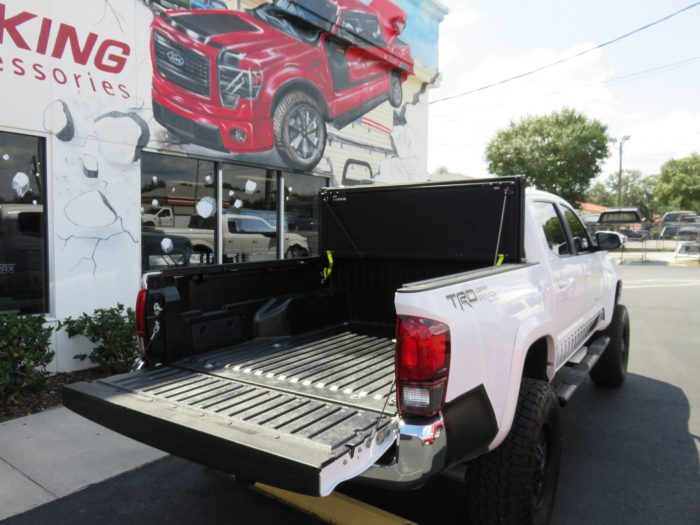 2019 Toyota Tacoma with LEER 350M, Nerf Bars, Hitch, Graphics, Bedliner by TopperKING in Brandon, FL 813-689-2449 or Clearwater FL 727-530-9066. Call today!