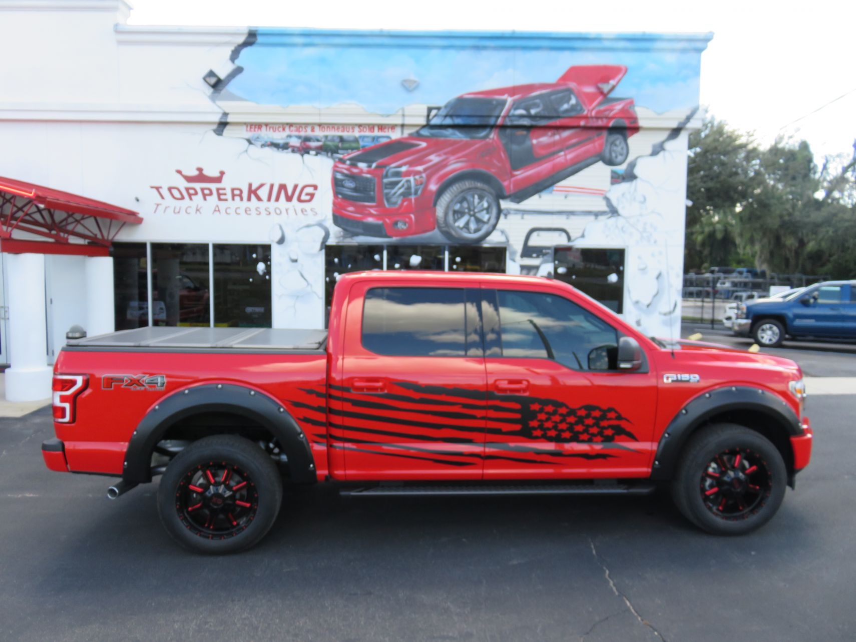 2019 Ford F150 with LEER 350M Custom Graphics, Fender Flares, Nerf Bars by TopperKING in Brandon, FL 813-689-2449 or Clearwater, FL 727-530-9066. Call now!