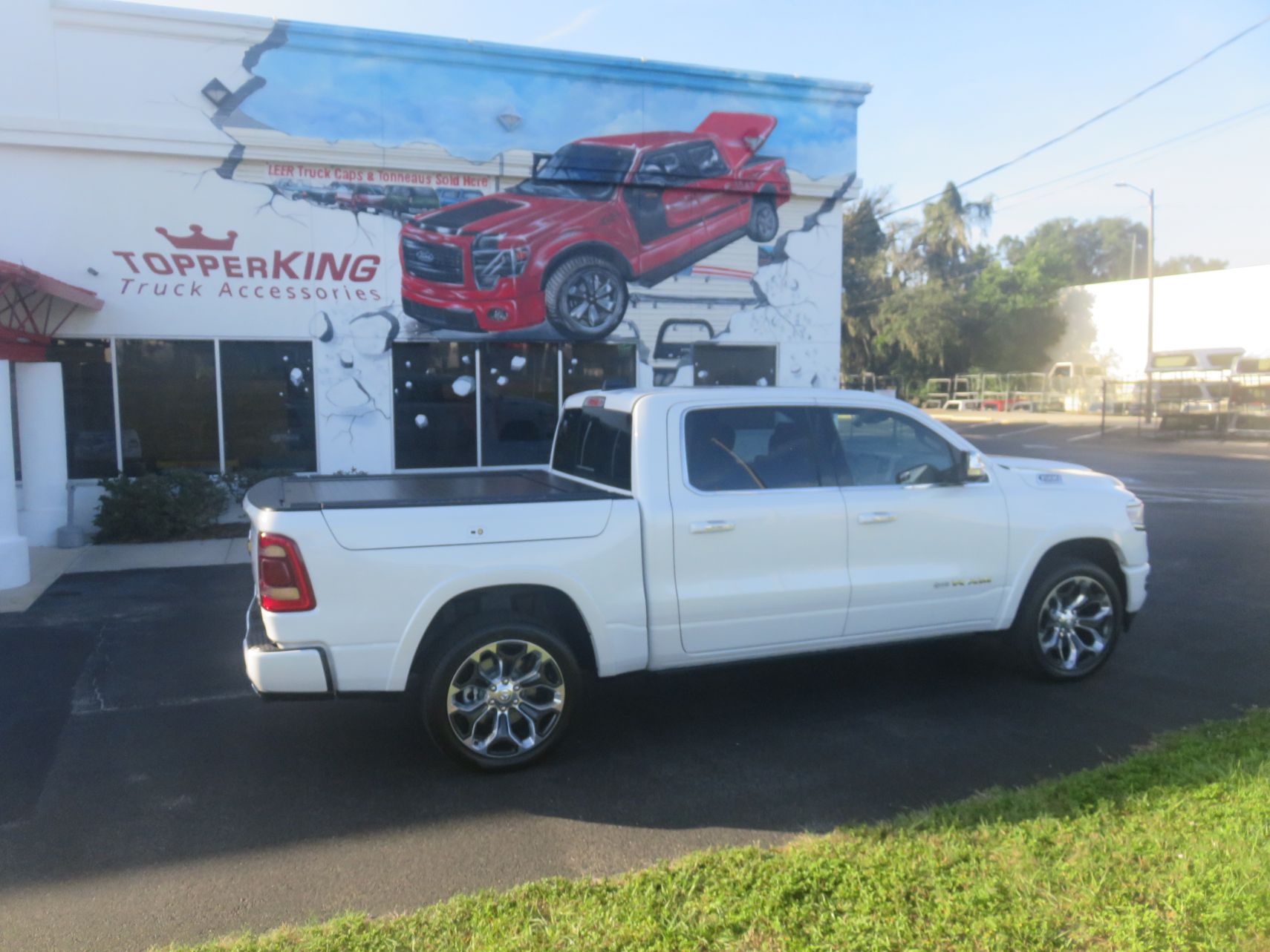 2020 Dodge Ram with Full Metal JackRabbit Tonneau, Chrome. Tint Hitch, by TopperKING in Brandon, FL 813-689-2449 or Clearwater, FL 727-530-9066. Call Today!