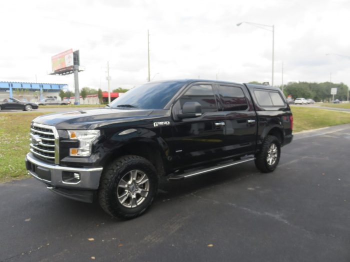 2019 Black Ford F150 with LEER 100XR, Nerf Bars, Tint, and Hitch by TopperKING in Brandon, FL 813-689-2449 or Clearwater, FL 727-530-9066. Call today!