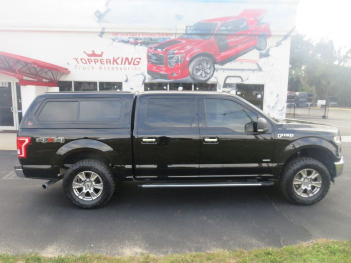 2019 Black Ford F150 with LEER 100XR, Nerf Bars, Tint, and Hitch by TopperKING in Brandon, FL 813-689-2449 or Clearwater, FL 727-530-9066. Call today!