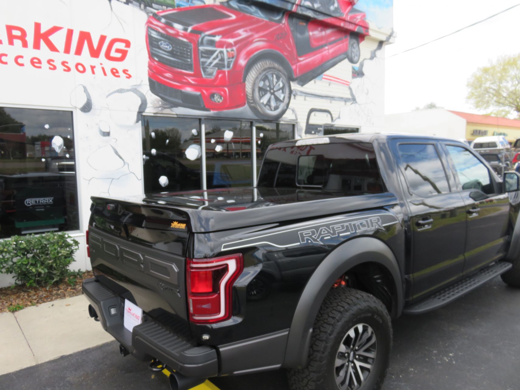 2020 Ford Raptor with LEER 750 Fiberglass Lid, Running Boards, Fender Flares, Tint, Hitch. Call TopperKING Brandon 813-689-2449 or Clearwater 727-530-9066!