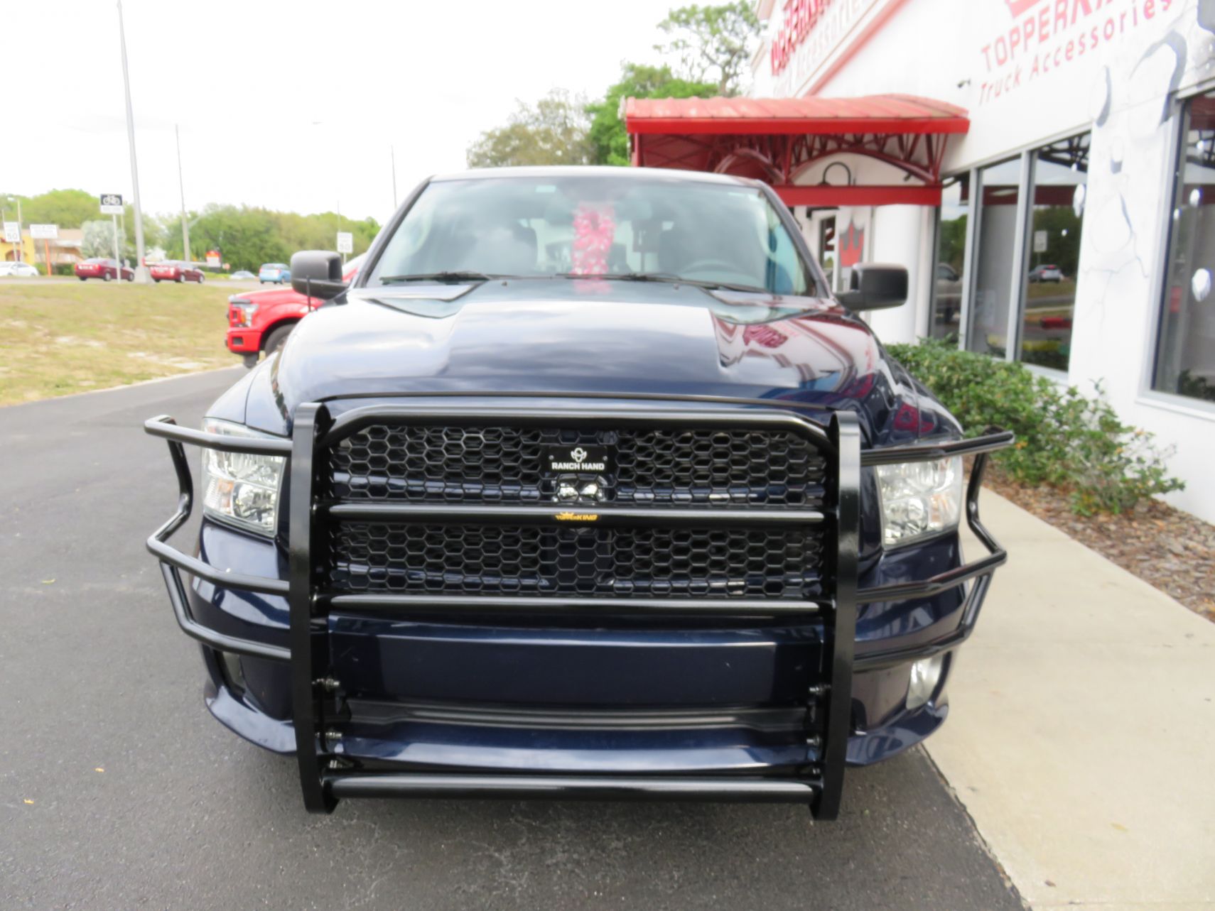 2019 Dodge RAM with Grill Guard, Blacked Out Nerf Bars, Hitch, Tint by TopperKING in Brandon, FL 813-689-2449 or Clearwater, FL 727-530-9066. Call today!