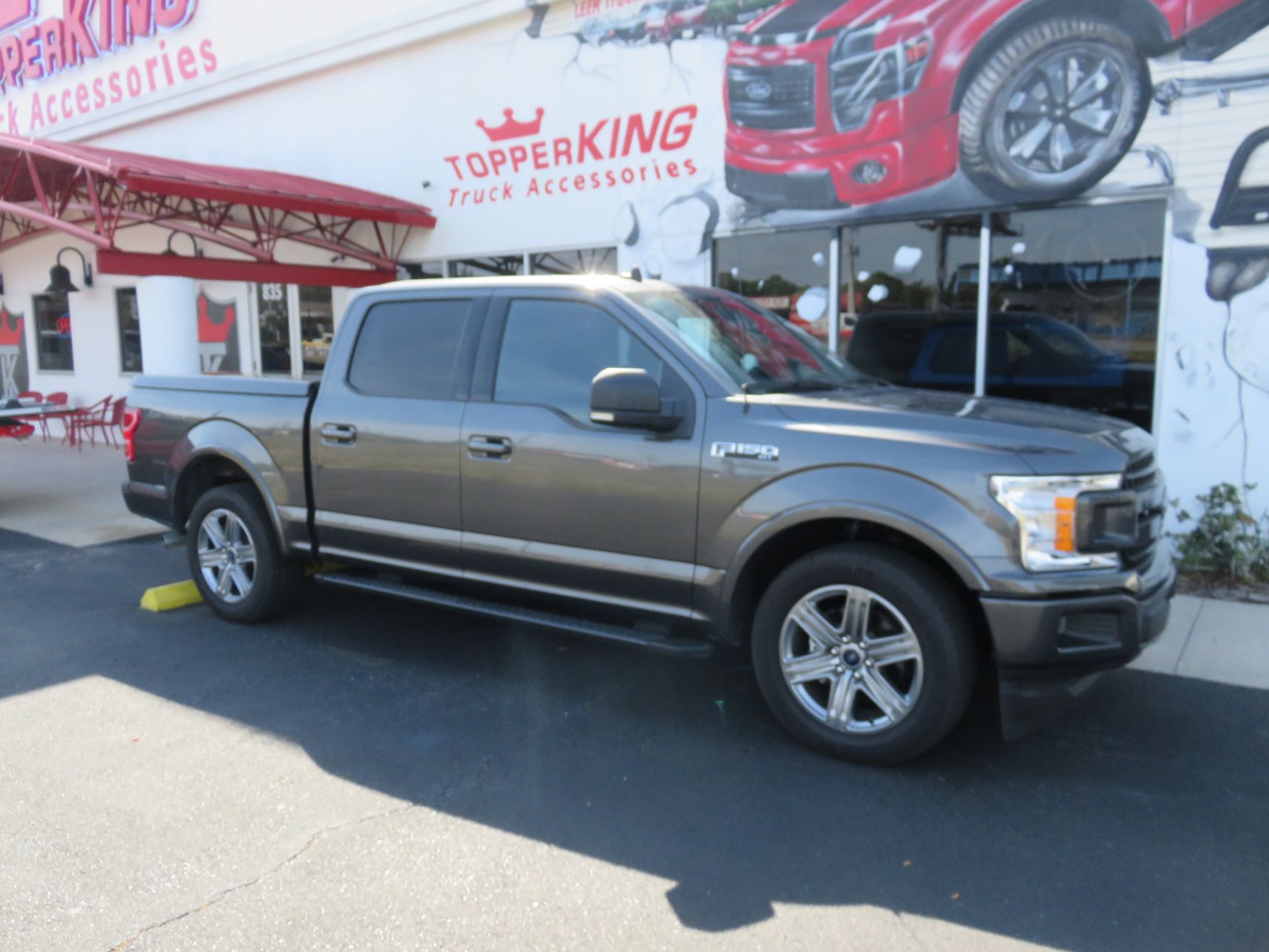 2019 Ford F150 with LEER 550 Fiberglass Lid, Running Boards, Hitch, Tint by TopperKING in Brandon FL 813-689-2449 or Clearwater FL 727-530-9066. Call today!