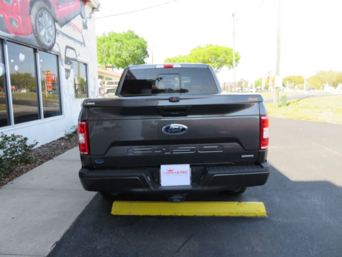 2019 Ford F150 with LEER 550 Fiberglass Lid, Running Boards, Hitch, Tint by TopperKING in Brandon FL 813-689-2449 or Clearwater FL 727-530-9066. Call today!