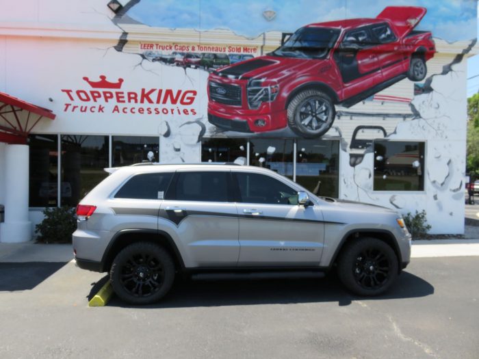 2019 Jeep Grand Cherokee with Graphics, Nerf Bars, Roof Racks, Tint, Hitch by TopperKING in Brandon FL 813-689-2449 or Clearwater FL 727-530-9066. Call now!