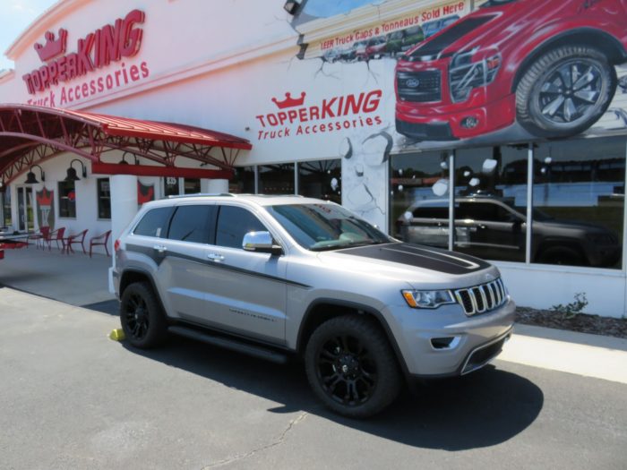 2019 Jeep Grand Cherokee with Graphics, Nerf Bars, Roof Racks, Tint, Hitch by TopperKING in Brandon FL 813-689-2449 or Clearwater FL 727-530-9066. Call now!