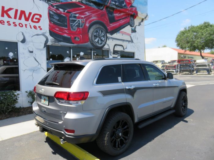 2019 Jeep Grand Cherokee with Graphics, Nerf Bars, Roof Racks, Tint, Hitch by TopperKING in Brandon FL 813-689-2449 or Clearwater FL 727-530-9066. Call now!