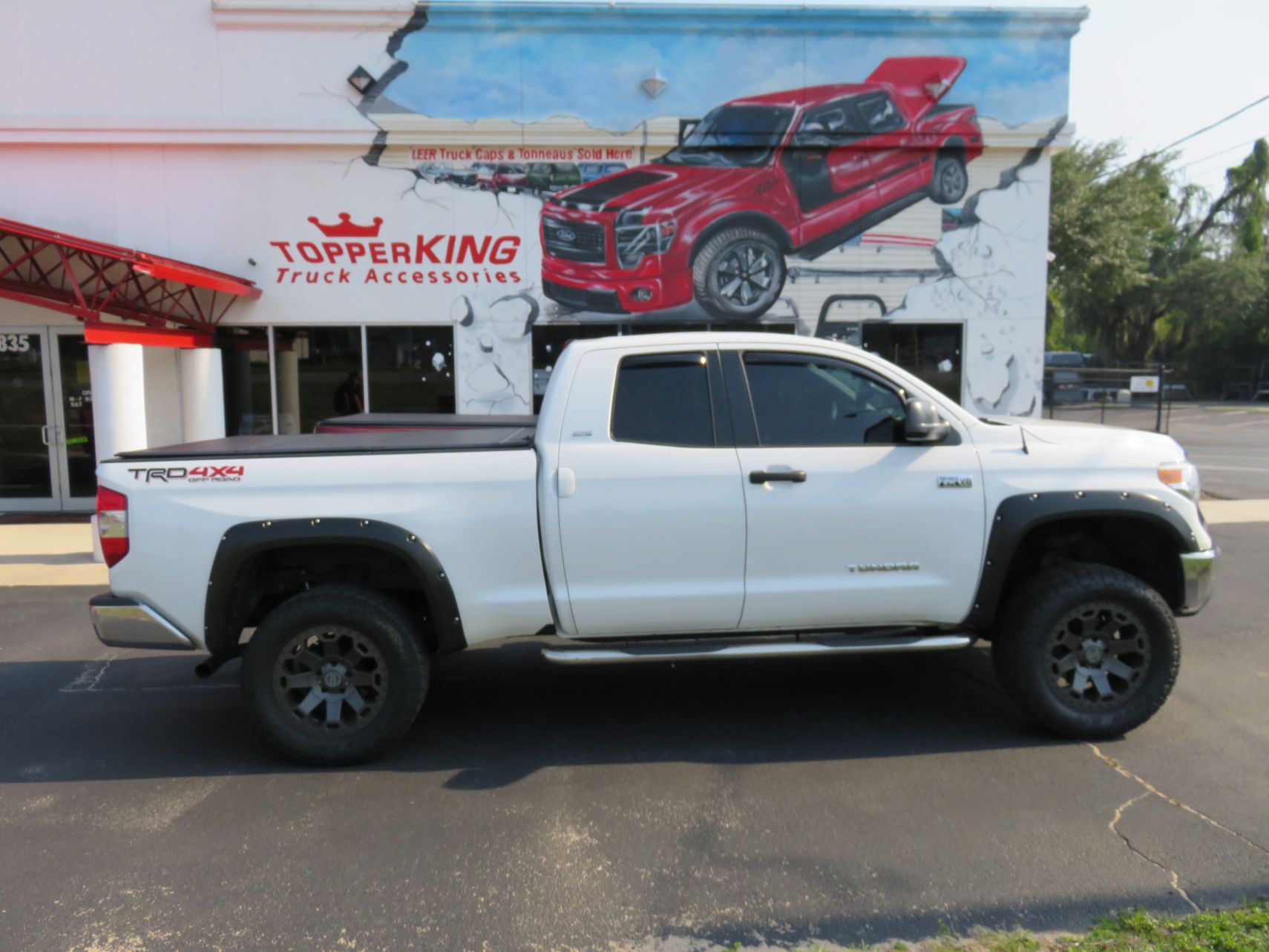 2019 Toyota Tundra with LEER 350M, Bedslide, Vent Visors, Nerf Bars, Hitch. Call TopperKING Brandon 813-689-2449 or Clearwater FL 727-530-9066