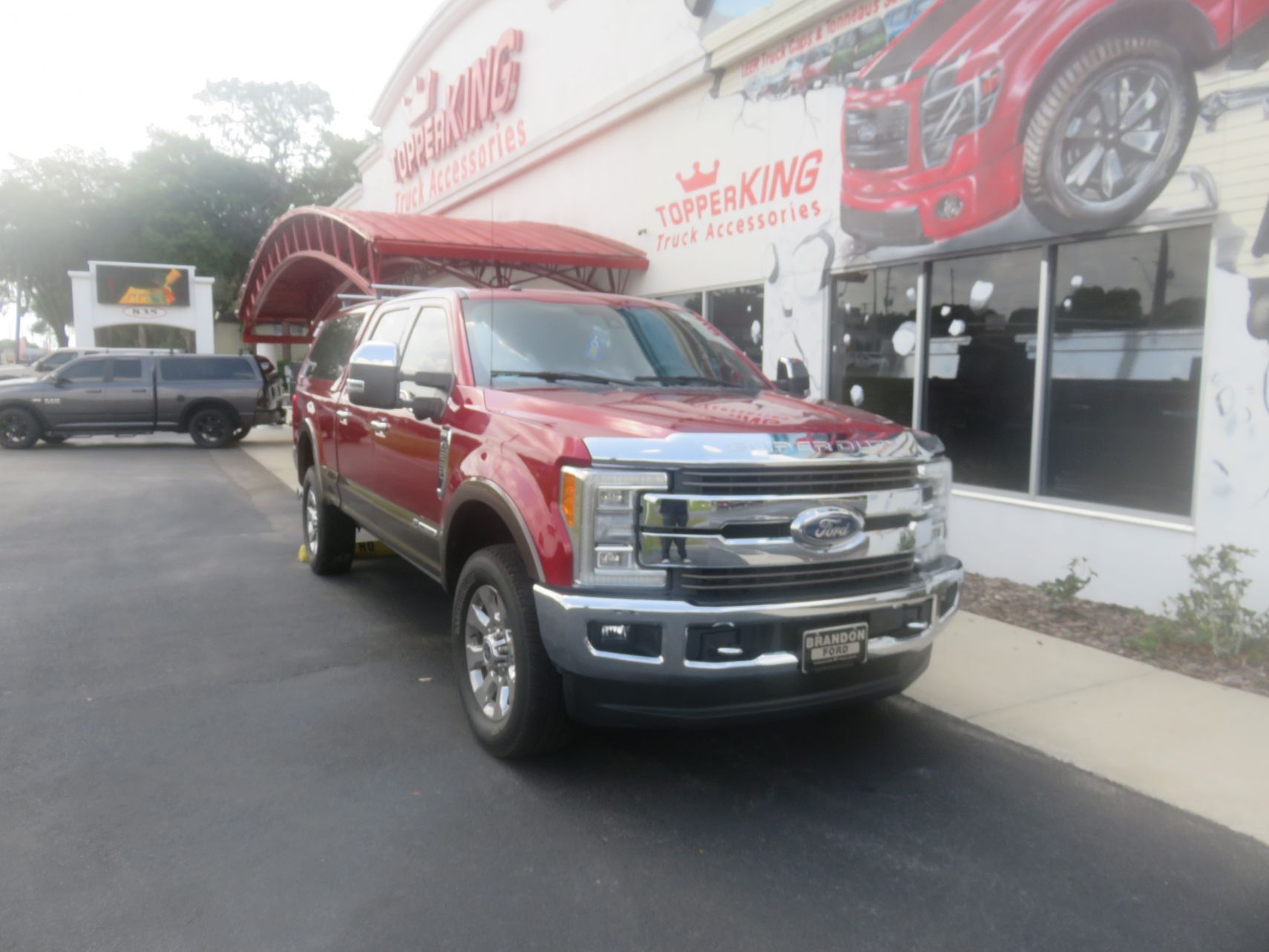 2020 Ford F250 with LEER 100XQ, Roof Racks, Chrome Hood guard, Retractable Steps, by TopperKING Brandon 813-689-2449 or Clearwater FL 727-530-9066. Call Us!