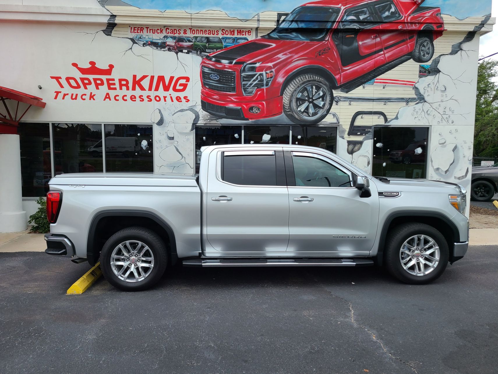 2020 GMC Sierra with LEER 700 Lid, Vent Visors, Bug Guard, Running Boards, Hitch, Tint by TopperKING Brandon 813-689-2449 or Clearwater 727-530-9066. Call!