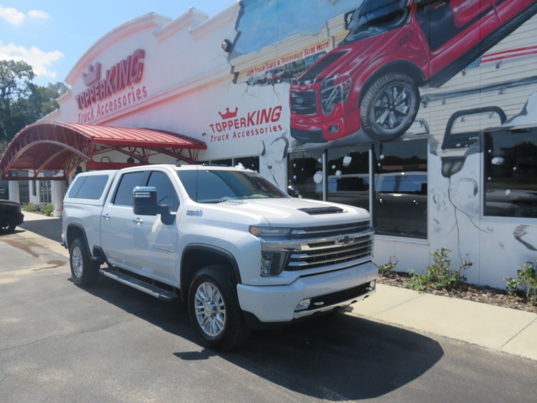 2020 Chevy Silverado with LEER 100XL, Nerf Bars, Chrome, Hitch, Tint by TopperKING in Brandon, FL 813-689-2449 or Clearwater, FL 727-530-9066. Call Today!