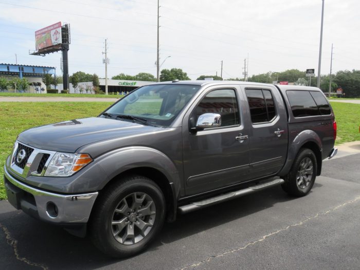 2019 Nissan Frontier with LEER 100XL Fiberglass Topper, Nerf Bars, Chrome, Hitch, Tint. Call TopperKING Brandon 813-689-2449 or Clearwater FL 727-530-9066.