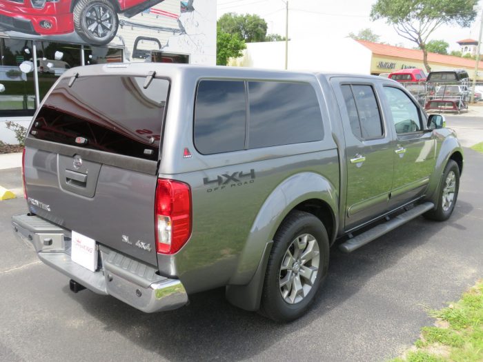 2019 Nissan Frontier with LEER 100XL Fiberglass Topper, Nerf Bars, Chrome, Hitch, Tint. Call TopperKING Brandon 813-689-2449 or Clearwater FL 727-530-9066.